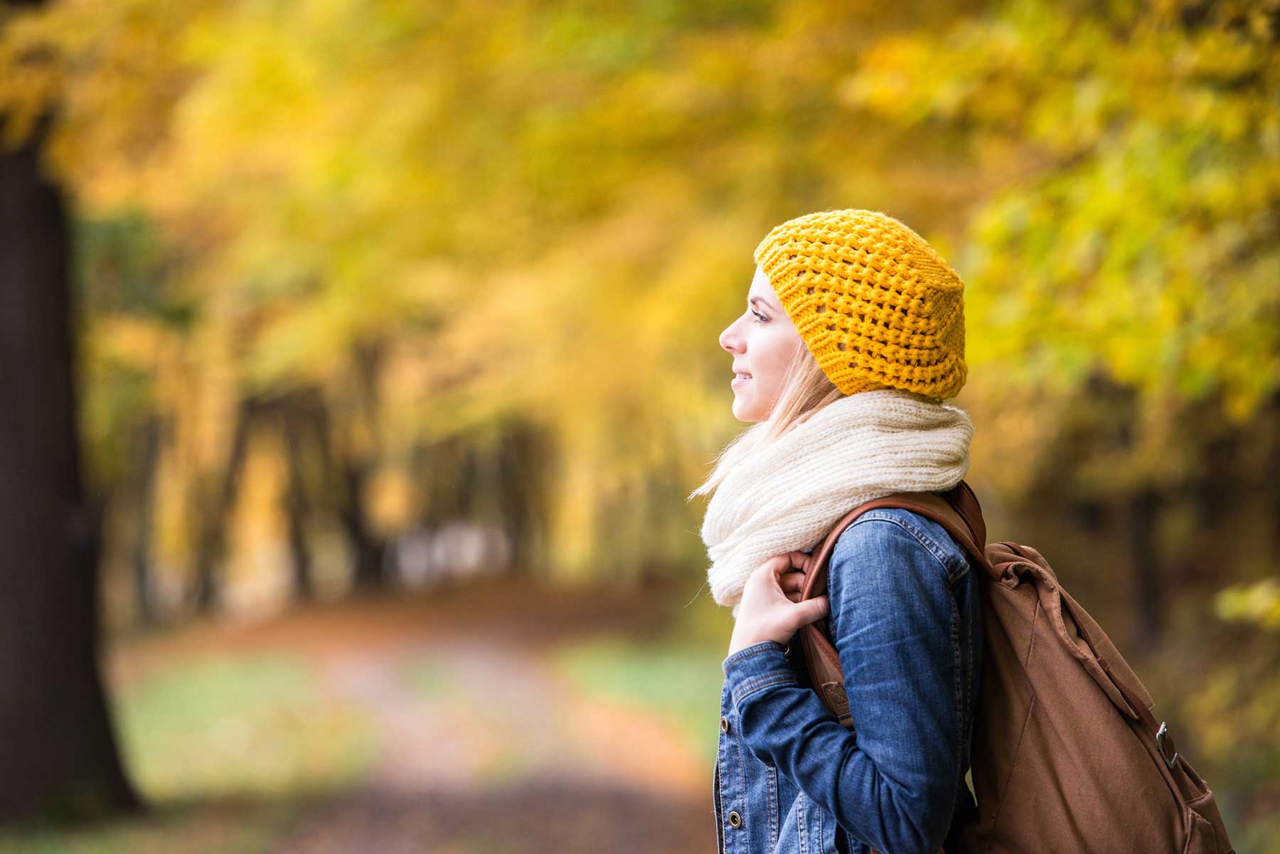 lady on a tree lined path