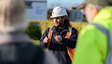 archaeologist taking a tour at Waterbeach