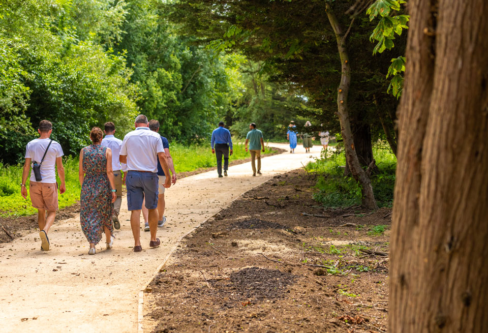 Group of people walking on the lakeside