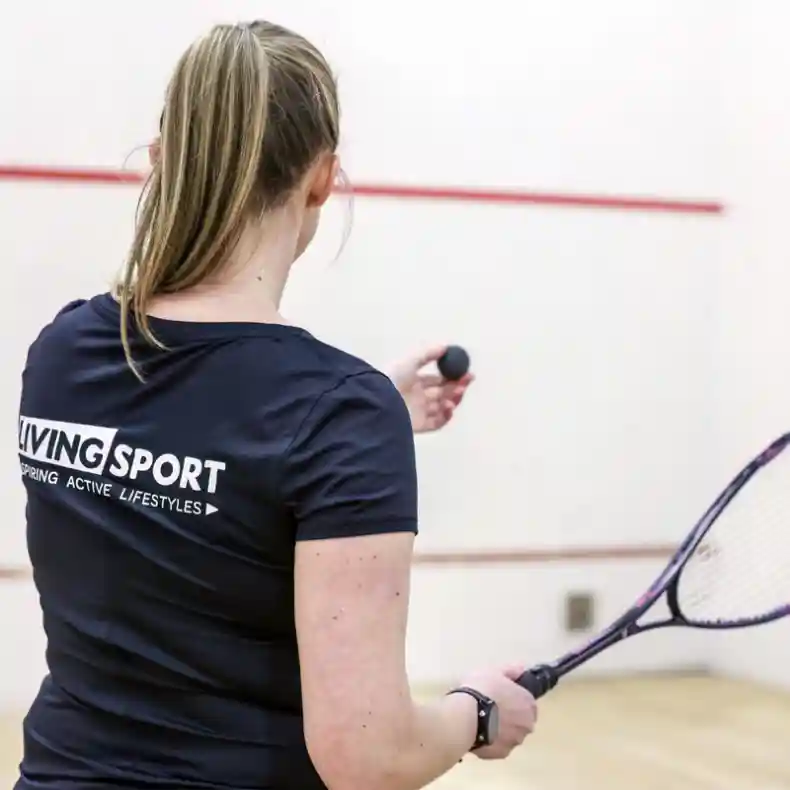 Woman playing squash