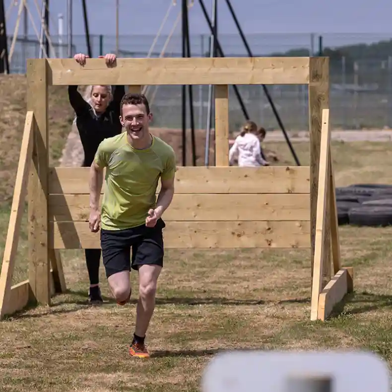 Man running an assault course